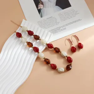 Detailed macro view of colorful retro acrylic beads in red, cream and tortoiseshell