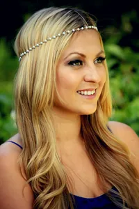 Close-up of elegant bohemian handmade pearl hair chain worn by a model in nature