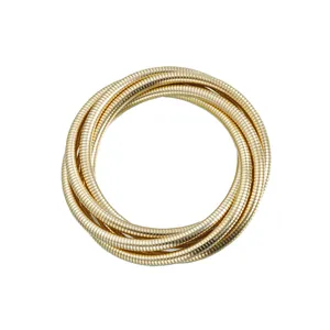 Detailed macro view of vintage multi-layer gold snake chain elastic bracelet for women