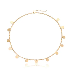 Close-up of golden metal tassel chain headband with shiny round sequin charms