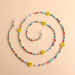 Colorful acrylic seed bead eyeglass chain with yellow smiley faces and non-slip loops.