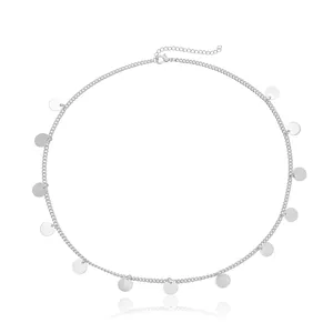 Detailed close-up shot of a silver metal chain headband with circular sequins