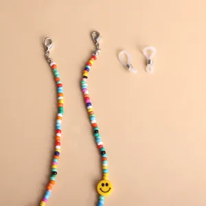 Detailed view of colorful acrylic beaded lanyard with a yellow smiley face and lobster clasps.
