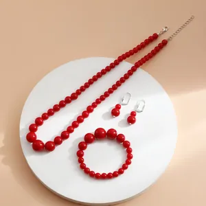 Detailed view of elegant red beaded jewelry set with necklace and bracelet