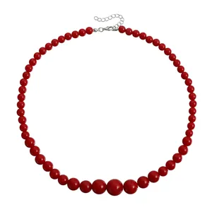 Minimalist red beaded necklace featuring graduated round beads and a lobster clasp closure