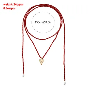 Long red seed bead necklace with gold heart pendant and 150cm length parameter detail