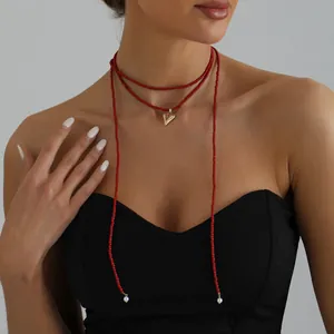 Trendy red seed bead long necklace with heart pendant and pearl details