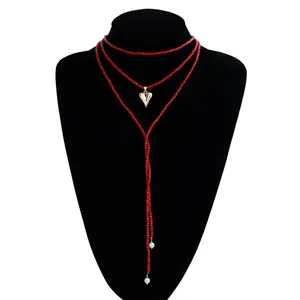 Trendy red seed bead long wrap necklace with gold heart pendant and white pearl accents