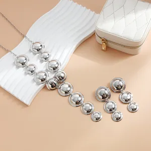 Polished silver geometric circular Y-shaped necklace and drop earring set for parties