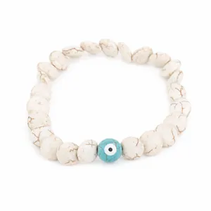 Handmade minimalist Evil Eye beaded bracelet featuring white marble textured Howlite beads