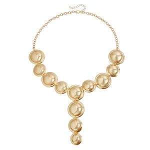 Statement vintage gold metallic Y-shaped necklace with polished geometric round discs