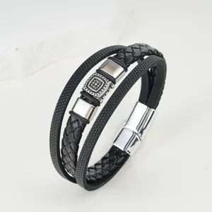 Detailed view of multilayer leather bracelet with retro pattern and magnetic clasp