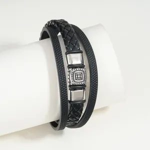 Detail view of black multi-layer leather bracelet with vintage magnetic clasp.
