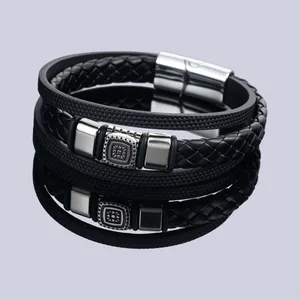 Close-up detail of multilayer leather bracelet featuring magnetic clasp and retro pattern