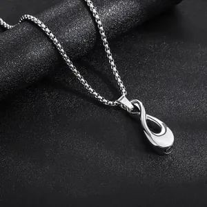 Close-up detail of a polished stainless steel teardrop infinity pendant necklace