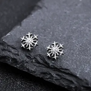 Detail view of F136 titanium snowflake stud earrings with sparkling cubic zirconia