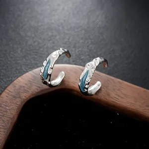 Elegant silver-tone ear cuffs featuring blue enamel accents, ideal for non-pierced ears