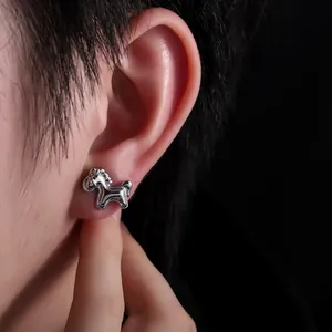 Detailed close-up showing a minimalist silver horse-shaped stud earring worn on an ear