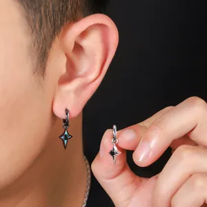 Detail of men's geometric hollow four-pointed star drop earrings in black and silver.