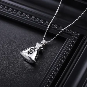 Detailed close-up of a silver money bag pendant with dollar sign engraving