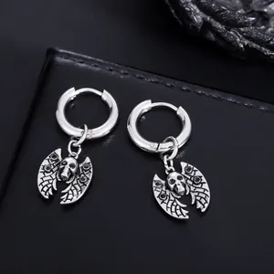 Close-up detail of gothic bat skull pendant hoop earrings in polished silver stainless steel.