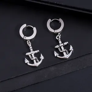 Close-up of stainless steel pirate anchor hoop earrings with rope detail on black background