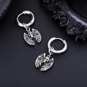 Detailed close-up of gothic bat skull pendant on stainless steel silver hoop earrings