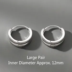Detail view of large silver hoop earrings with a 12mm inner diameter, minimalist.