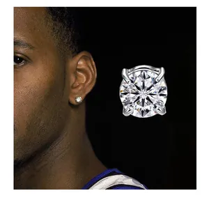 Close-up detail of a minimalist round-cut diamond stud earring for men.