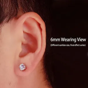 Detailed close-up shot of a 6mm minimalist silver stud earring worn on a male earlobe