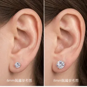 Side-by-side comparison of 6mm and 8mm minimalist stud earrings on a model's ear.