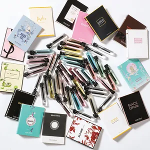 Detailed view of various perfume sample glass vials with colorful luxury-style tester cards