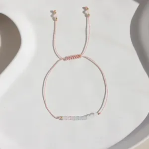 Elegant hand-woven adjustable bracelet featuring natural moonstone and white crystal beads.