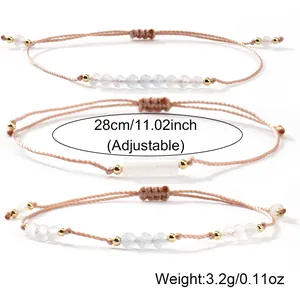 Elegant handmade moonstone and white quartz woven bracelet with an adjustable cord.
