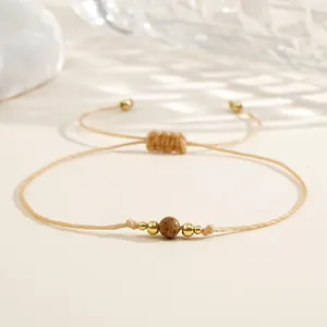 Bracelet minimaliste en fil ciré kaki avec perles en cuivre et pierre semi-précieuse