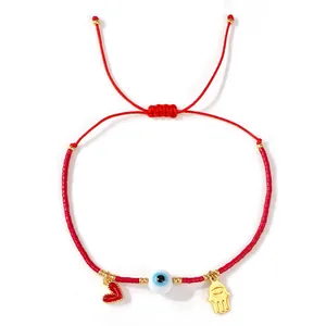 Handmade red evil eye beaded bracelet with heart and hamsa charms for women