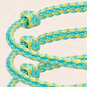 Macro detail of an eight-strand braided hand rope with turquoise and lime stripes