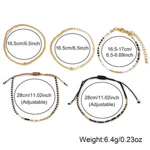 Handmade set of 5 stackable seed bead bracelets in black white and gold boho style