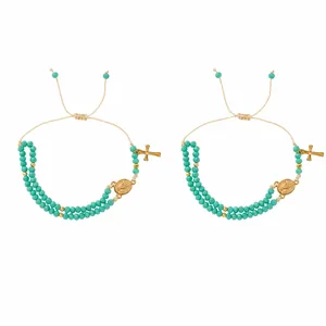 Handmade turquoise beaded bracelet for women featuring vintage gold cross and coin charms