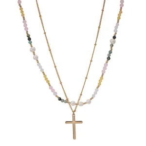 Elegant multi-layered necklace with colorful beads, pearls, and gold cross pendant