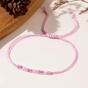 Braccialetto intrecciato rosa fatto a mano con perline colorate sfumate da donna