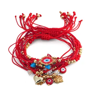 Handmade evil eye red string braided bracelet set with heart charms and golden beads