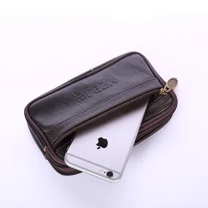 Close-up detail of the double zipper compartments on a brown men's synthetic leather waist bag