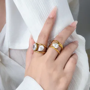Elegant gold plated multi-layer rings featuring pear-shaped zircons shown on hand