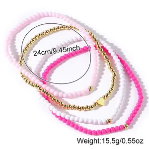 Bellissimo set di 4 cavigliere di perle in acrilico e oro con dettaglio ciondolo a cuore