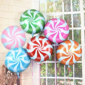 Assorted colorful lollipop swirl foil balloons on display for festive party decoration