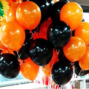 Detailed view of a cluster of 5-inch orange and black latex balloons for party decoration