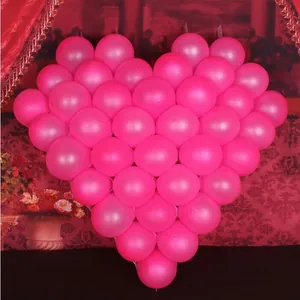 Detailed view of pink latex balloons arranged in a romantic heart shape decoration