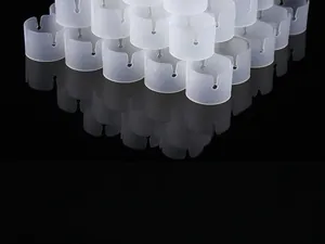 Close-up of semi-transparent white plastic clips for wedding arch pole assembly