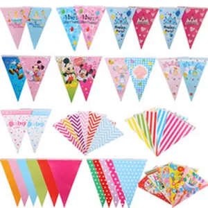 Collection of assorted colorful triangular party bunting banners with various cartoon themes